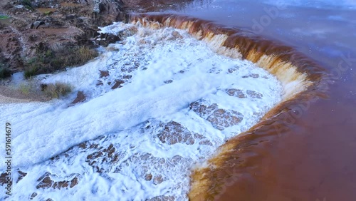 Rio Tinto textures. Aerial view from a drone in the surroundings of the town of Berrocal. Sierra Morena, Gulf of Cádiz, Huelva, Andalusia, Spain, Europe photo