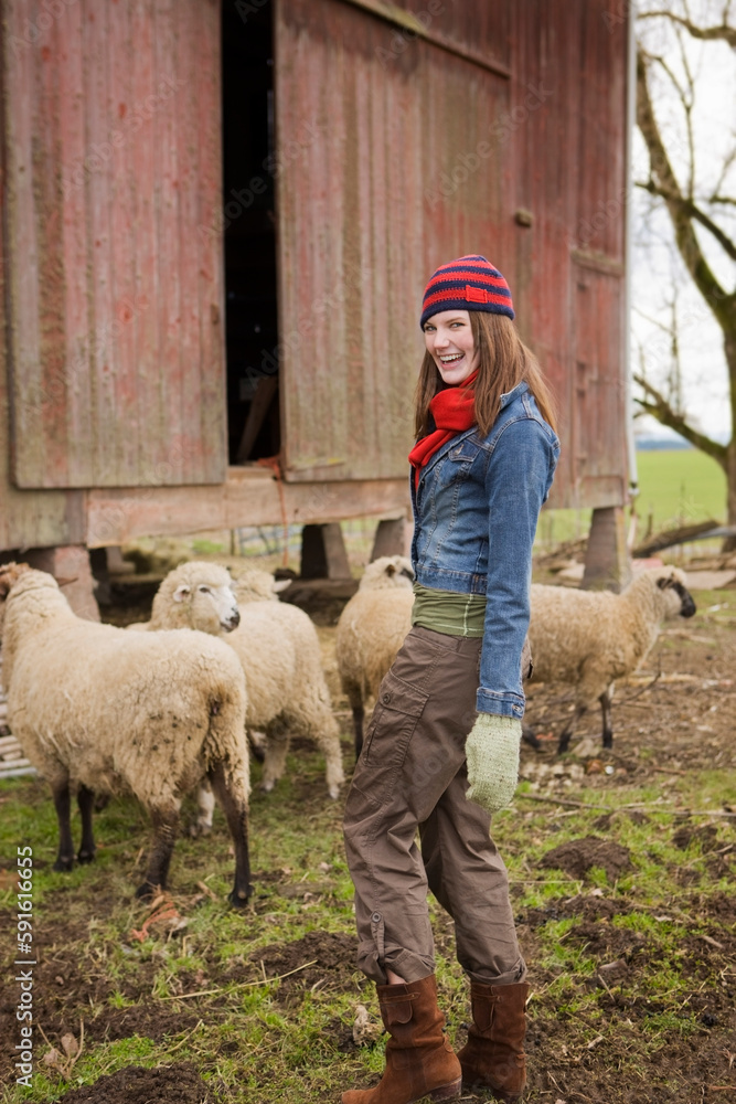 Teenage Girl With a Flock of Sheep on a Farm in Hillsboro, Oregon, USA Teenage Girl With a Flock of Sheep on a Farm in Hillsboro, Oregon, USA
