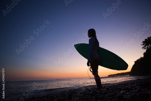 Surfer on the Beach Admiring the Sunset, Punta Burros, Nayarit, Mexico photo