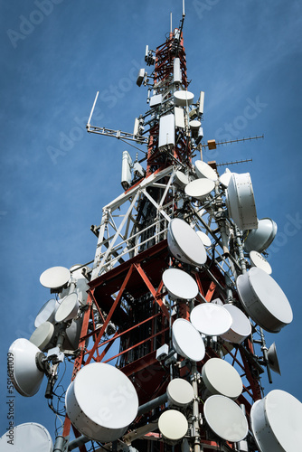 High-quality photo of a 5G antenna tower against a dramatic sky. Perfect for illustrating the technology and connectivity of modern mobile networks