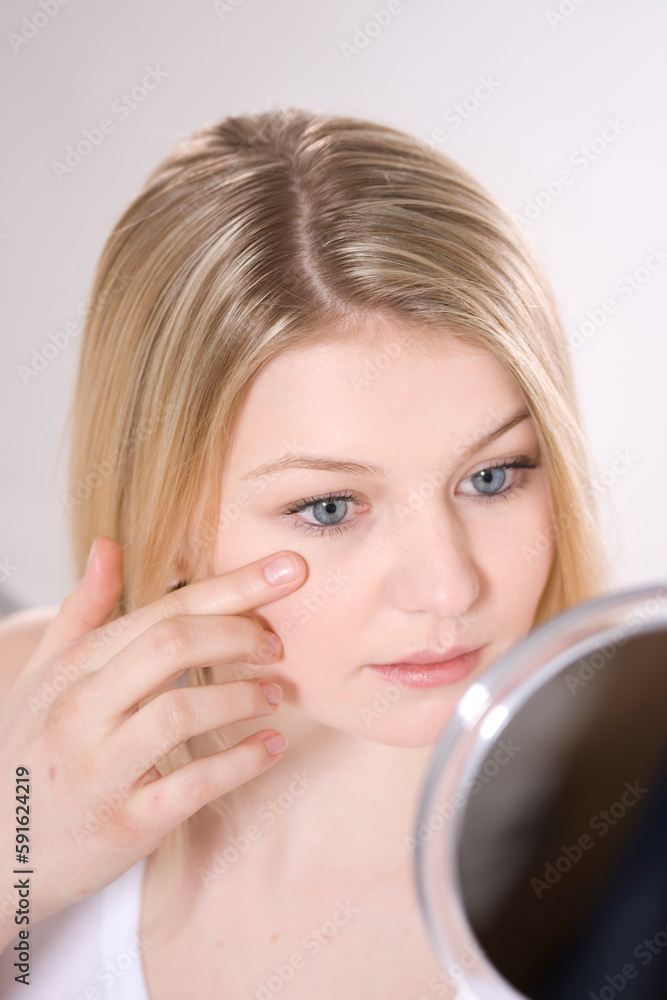 Woman Looking in Mirror