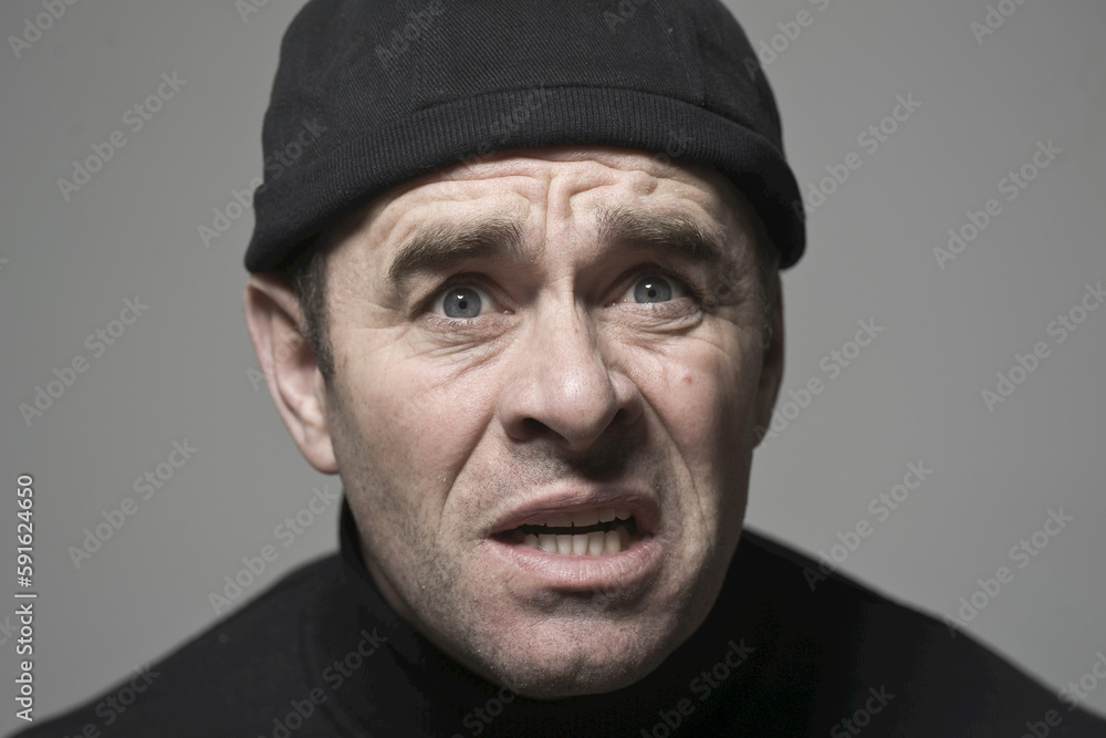 Man in Black Cap Looking Scared Man in Black Cap Looking Scared