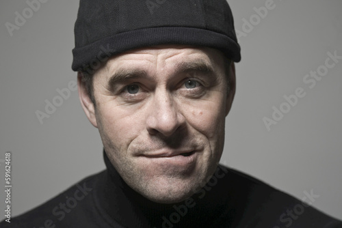 Portrait of Man in Black Cap