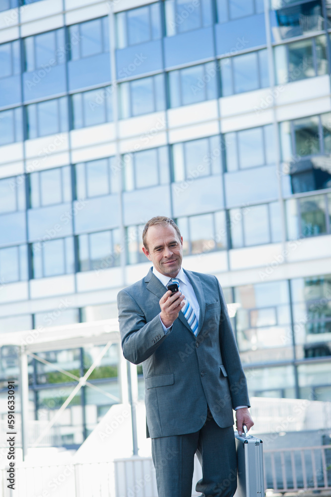 Businessman using Cell Phone, Niederrad, Frankfurt, Germany Businessman using Cell Phone, Niederrad, Frankfurt, Germany