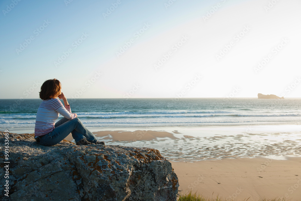 Woman Looking into the Distance at the Beach, Camaret-sur-Mer, Crozon Peninsula, Finistere, Brittany, France Woman Looking into the Distance at the Beach, Camaret-sur-Mer, Crozon Peninsula, Finistere, Brittany, France