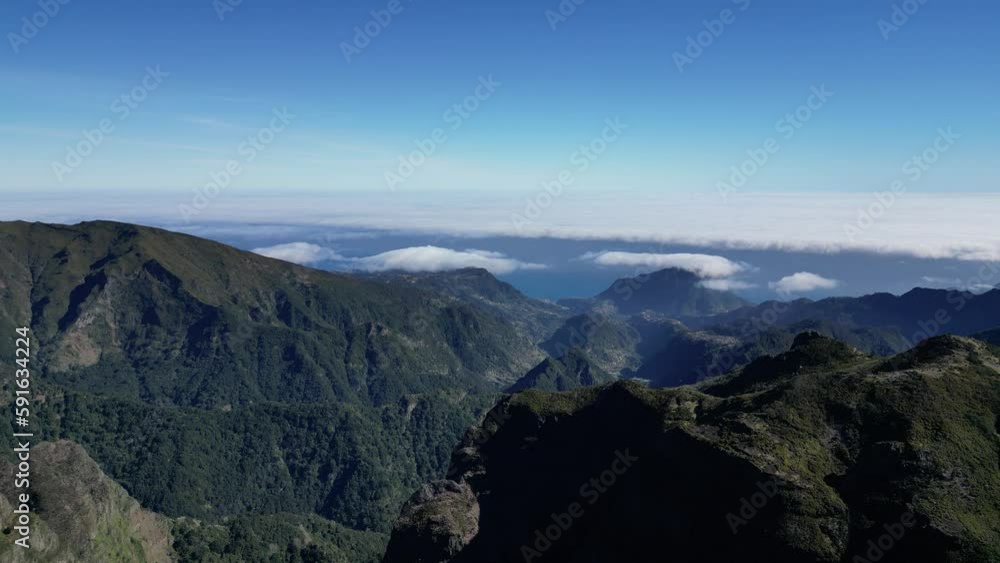 Aerial of the beautiful green mountains of Madeira Island in Portugal on a sunny day Aerial of the beautiful green mountains of Madeira Island in Portugal on a sunny day