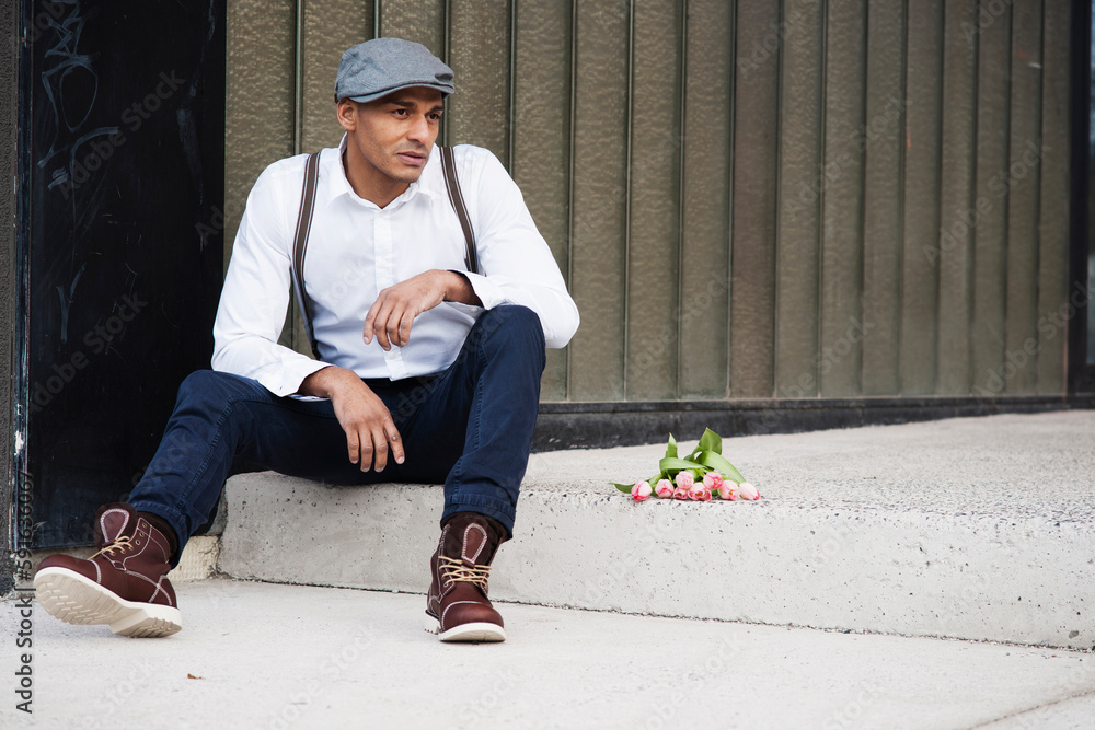 Portrait of Man Sitting on Step with Flowers, Mannheim, Baden-Wurttemberg, Germany Portrait of Man Sitting on Step with Flowers, Mannheim, Baden-Wurttemberg, Germany
