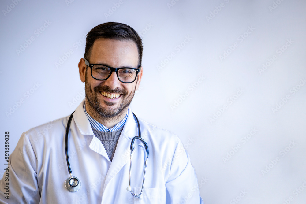 Portrait of smiling doctor with stethoscope on white background.