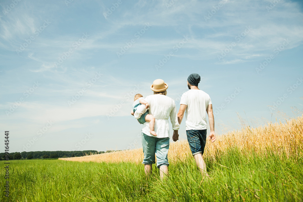 Family Walking by Agricultural Field, Mannheim, Baden-Wurttemberg, Germany Family Walking by Agricultural Field, Mannheim, Baden-Wurttemberg, Germany