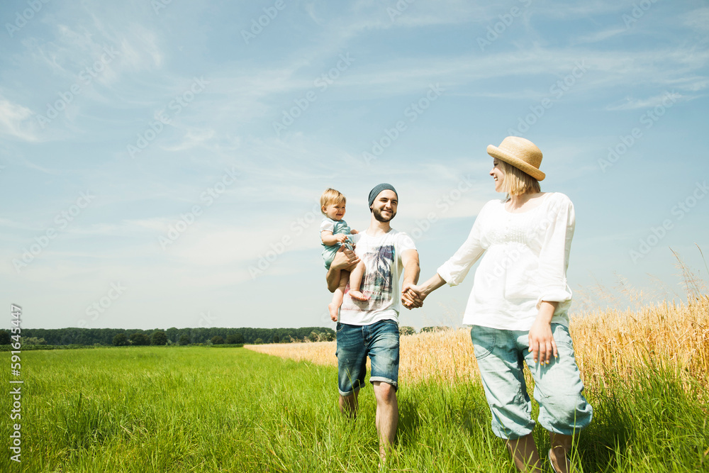 Family Walking by Agricultural Field, Mannheim, Baden-Wurttemberg, Germany Family Walking by Agricultural Field, Mannheim, Baden-Wurttemberg, Germany