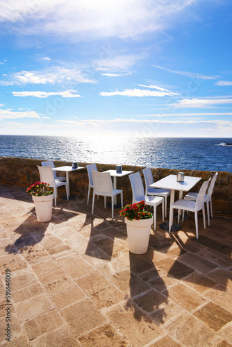 Cafe terrace by the seaside in Gallipoli. Architecture of Gallipoli in Apulia, Italy, Europe © Rechitan Sorin