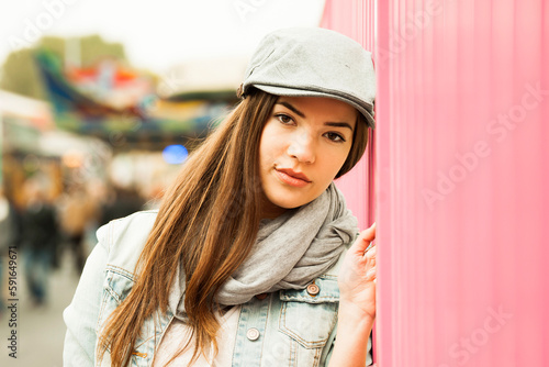 Close-up portrait of teenage girl wearing hat at amusement park, looking at camera, Germany photo