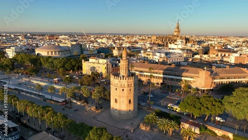 Aerial drone footage of the Seville city the Guadalquivir canal with the cathedral, the Torre del Oro, the tower of gold, Andalusia, Spaine