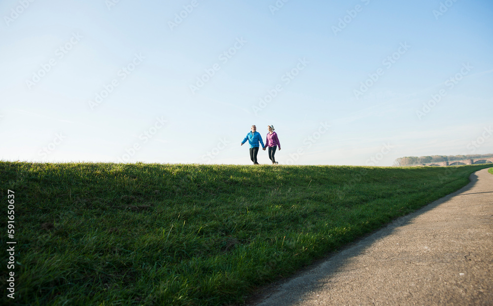 Couple Walking Outdoors, Mannheim, Baden-Wurttemberg, Germany Couple Walking Outdoors, Mannheim, Baden-Wurttemberg, Germany