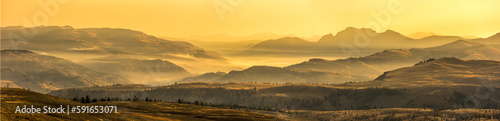 Golden sunrise over the mountain peaks of the Absaroka Range in the Lamar Valley; Yellowstone National Park, United States of America photo