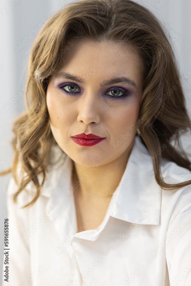 Portrait of attractive beautiful fashionable young woman dressed in the style of 1980s, with bright fancy make up. 80s inspiration and vibes Portrait of attractive beautiful fashionable young woman dressed in the style of 1980s, with bright fancy make up. 80s inspiration and vibes