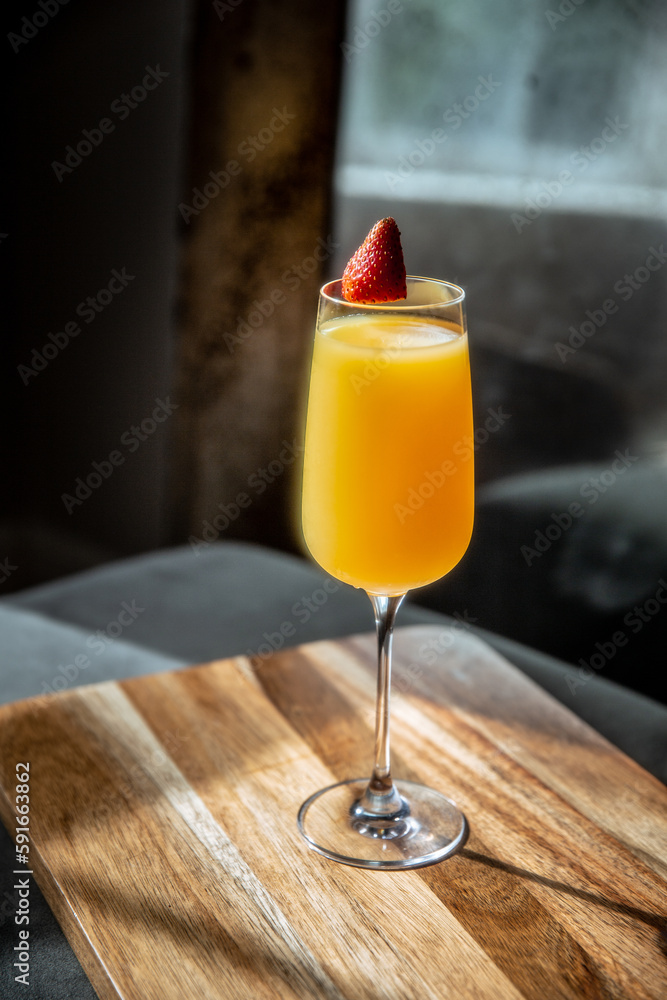 Mimosa with Strawberry Garnish in Decorative Setting Mimosa with Strawberry Garnish in Decorative Setting