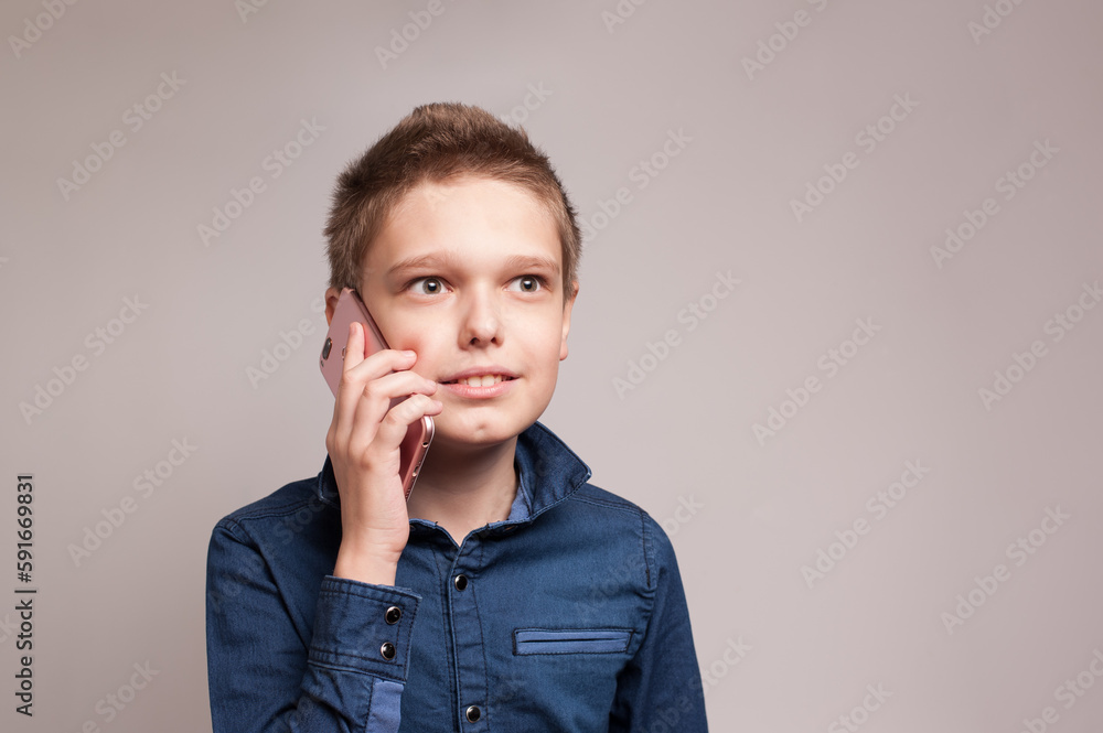 Portrait of teenage boy with smartphone in his hand Portrait of teenage boy with smartphone in his hand