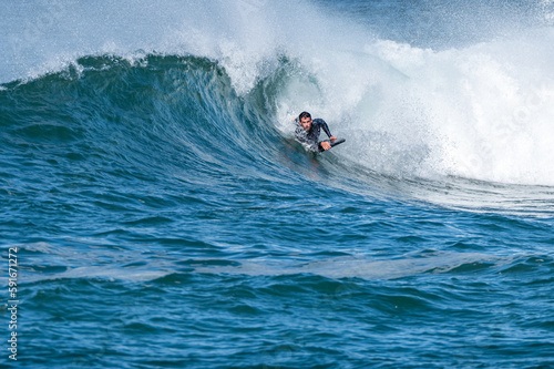Photography Bodyboarder surfing ocean wave