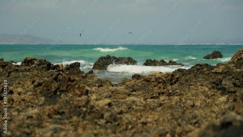A narrow strip of sea, overlooking the island, ride kites. A narrow strip of sea, overlooking the island, ride kites.