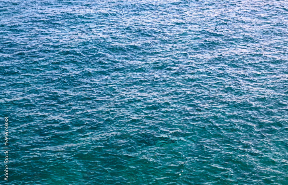 Obraz premium Abstract blue ocean water background.Sea waves natural texture for design.Selective focus. 