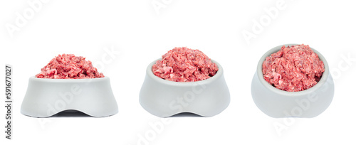 Natural fresh raw meat food in pet bowl from different angles isolated on white