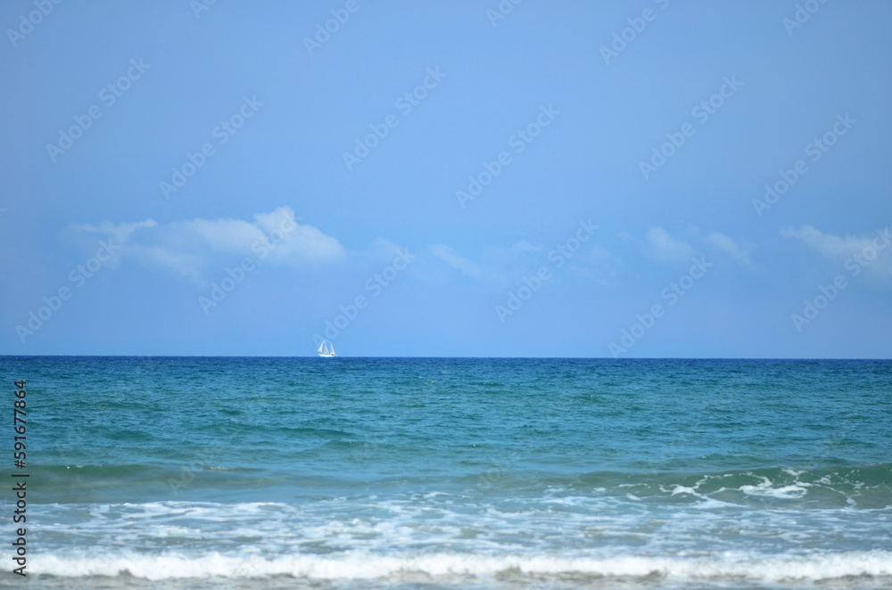 Yacht in the distance in the sea