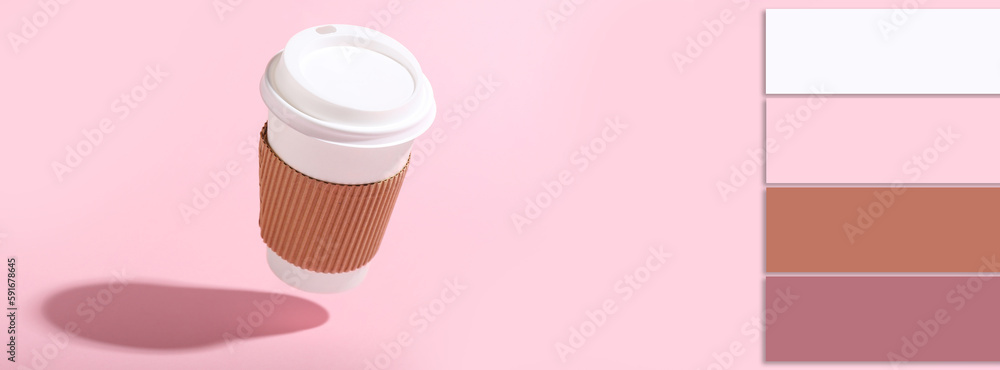 Flying takeaway paper cup on pink background. Different color patterns