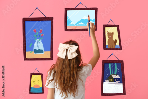 Cute little girl painting p...