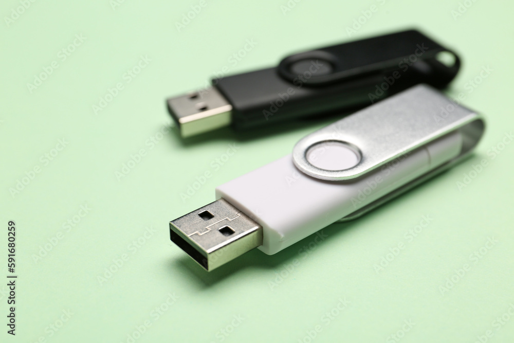 USB flash drives on green background USB flash drives on green background