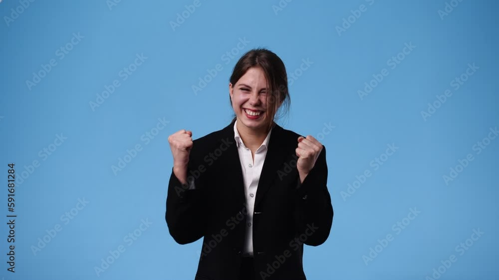 4k video of girl raising hands in surprise looking at camera with big eyes on blue background. 4k video of girl raising hands in surprise looking at camera with big eyes on blue background.