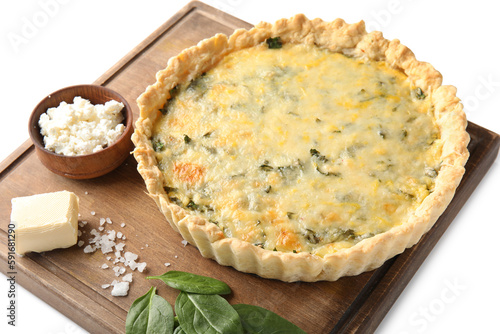 Board with delicious quiche, cottage cheese, feta and spinach leaves isolated on white background