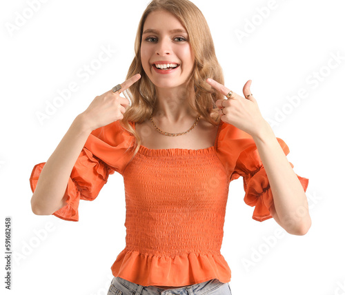 Young woman pointing at her...