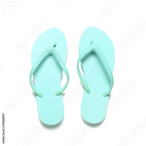 Pair of blue flip-flops on white background