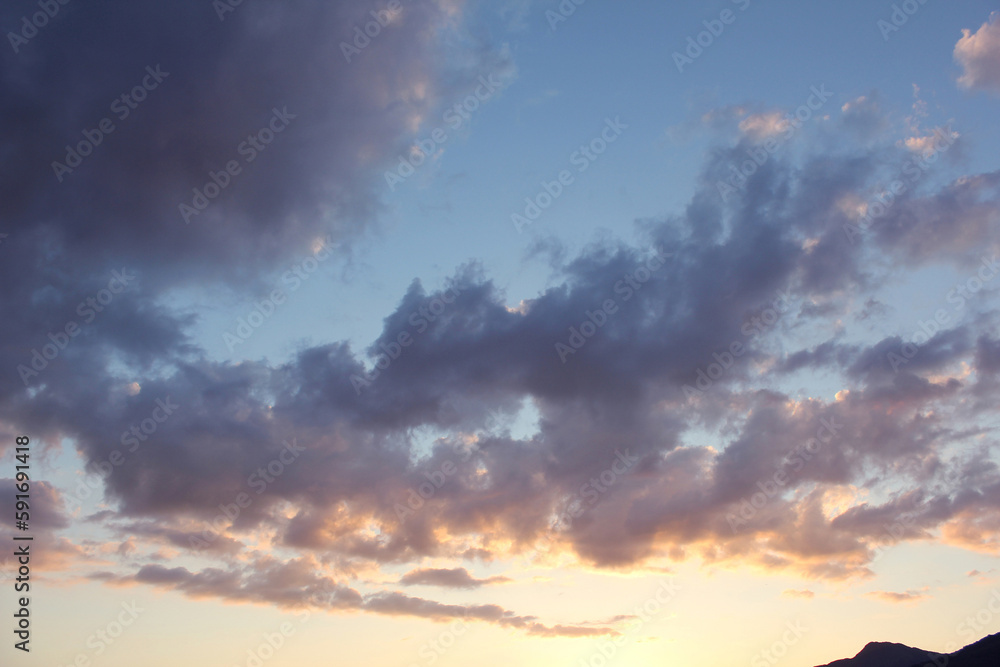 cloud and vanilla sky background with dark mountain silhouette