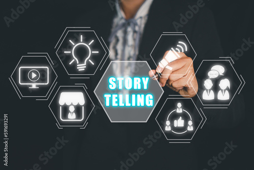Story telling concept, Business person hand touching story telling icon on virtual screen.