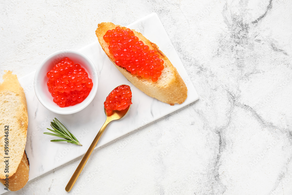 Tasty bruschettas with red caviar on grunge background Tasty bruschettas with red caviar on grunge background