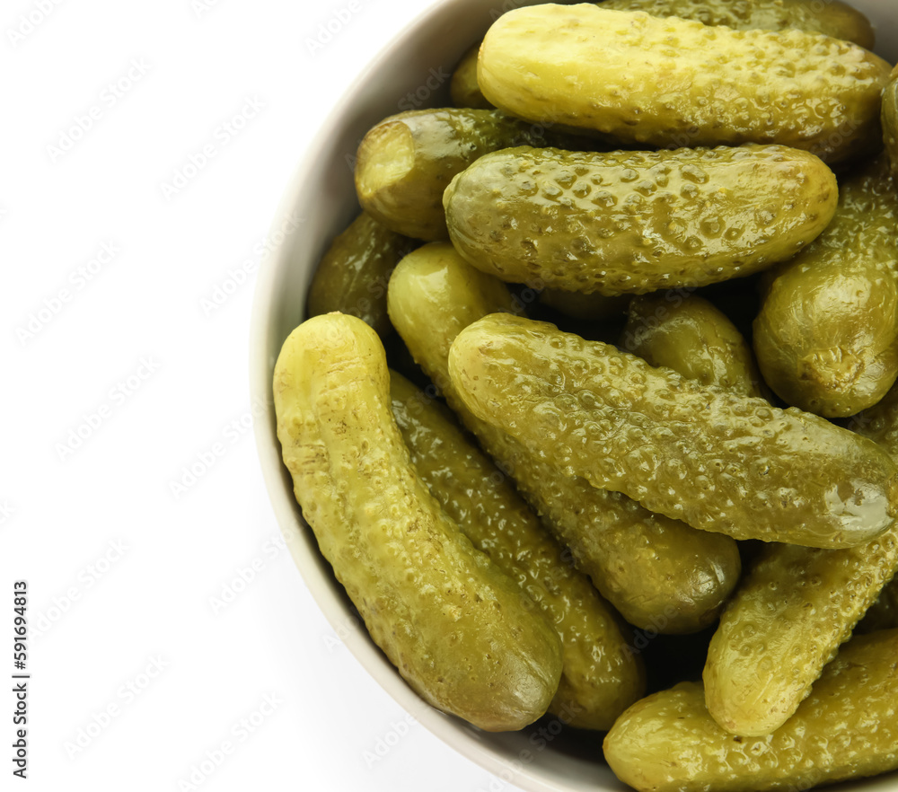 Bowl with tasty fermented cucumbers on white background Bowl with tasty fermented cucumbers on white background