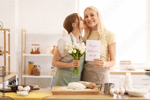 Young woman greeting her mo...