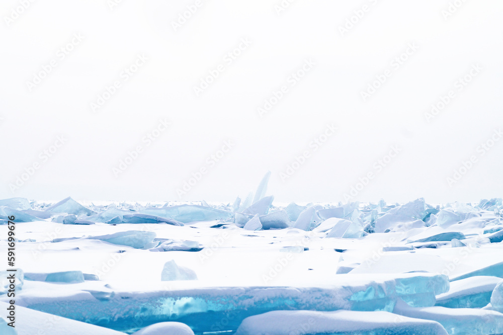 Fototapeta premium Hummocks under the snow on the ice of Lake Baikal