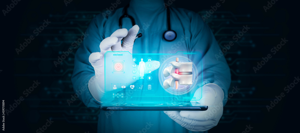 Spinal herniation, herniated disc. lower back pain spine. severe disc pain Chiropractic. Doctor with tablet shows the herniated disc with modern digital technology. Black background Spinal herniation, herniated disc. lower back pain spine. severe disc pain Chiropractic. Doctor with tablet shows the herniated disc with modern digital technology. Black background