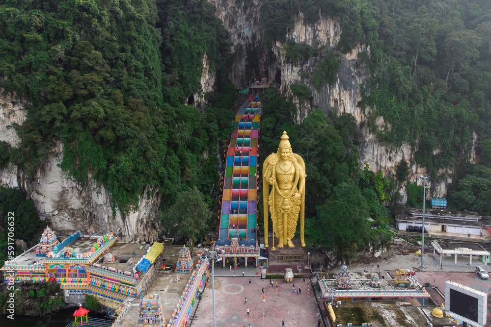 Aerial view of the Batu Cave Murugan temple with the golden Murugan