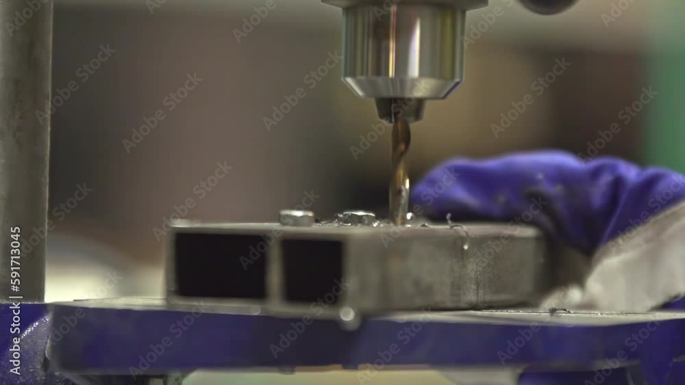 Drill going into metal closeup Drill going into metal closeup