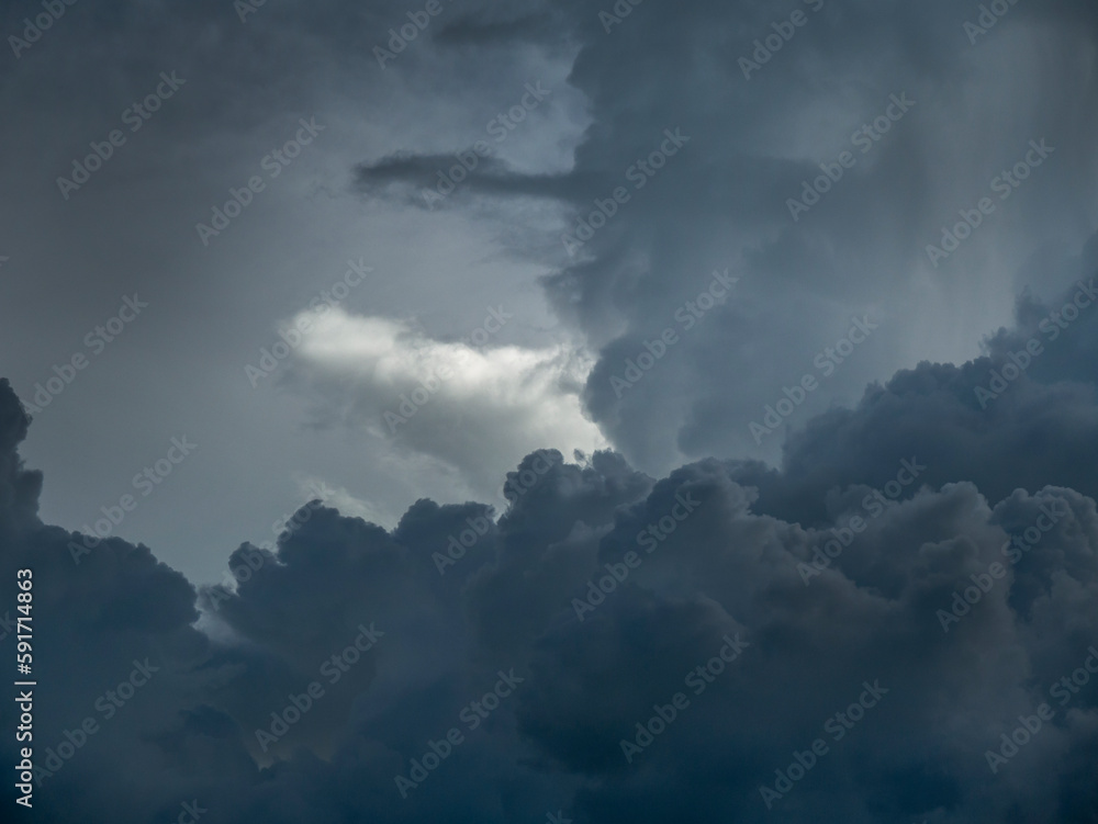 Dramatic dark storm thundercloud rain clouds on black sky background. Dark thunderstorm clouds rainny landscape. Meteorology danger windstorm disaster climate. Dark cloudscape storm disaster gray sky