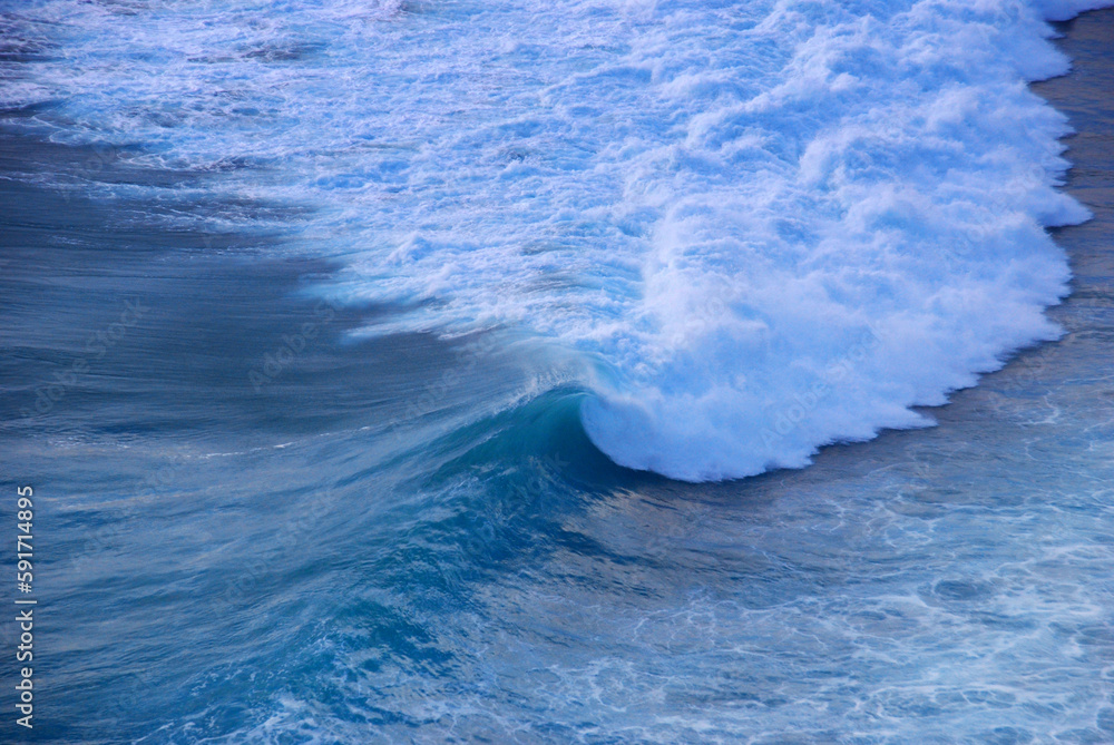 Fototapeta premium Blue sea marine ocean seascape tropical huge wave on blurred background. Seascape blue ocean white wave motion outdoor. Aqua marine huge wave sea summer background. Paradise turquoise water landscape