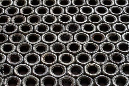 Texture made of iron nuts. Pattern of old steel nuts.