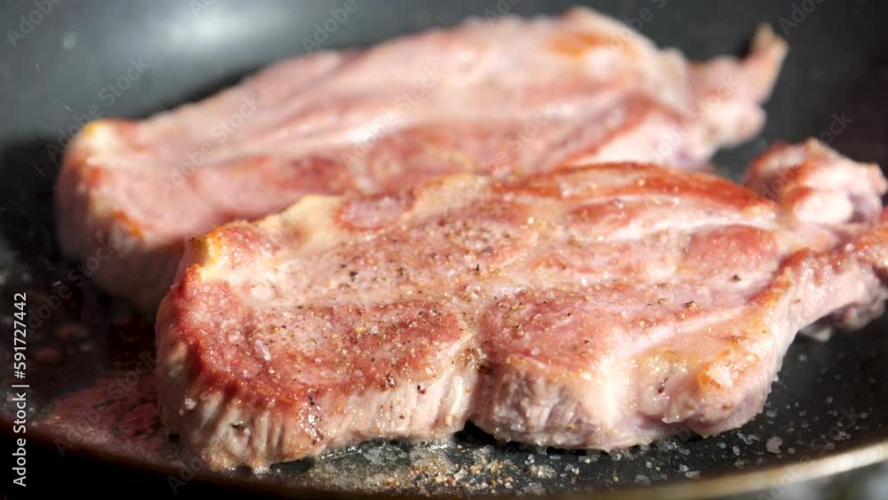 Searing fillet steaks in a frying pan. High quality 4k footage Searing fillet steaks in a frying pan. High quality 4k footage