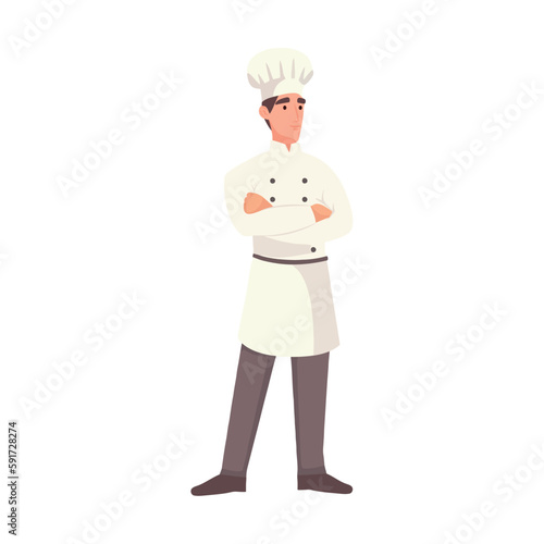 Chef standing in uniform, smiling with pride