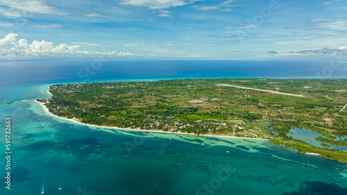 Aerial seascape with tropical island and beach in the sea. Bantayan island, Philippines.
