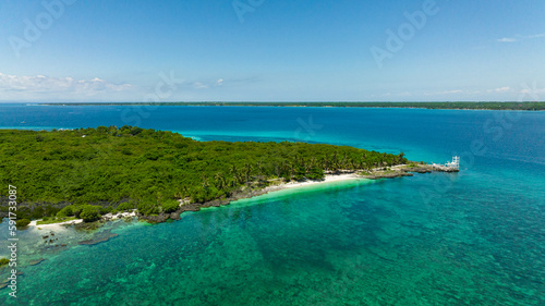 Island with a beach in the tropics. Virgin Island, Philippines.